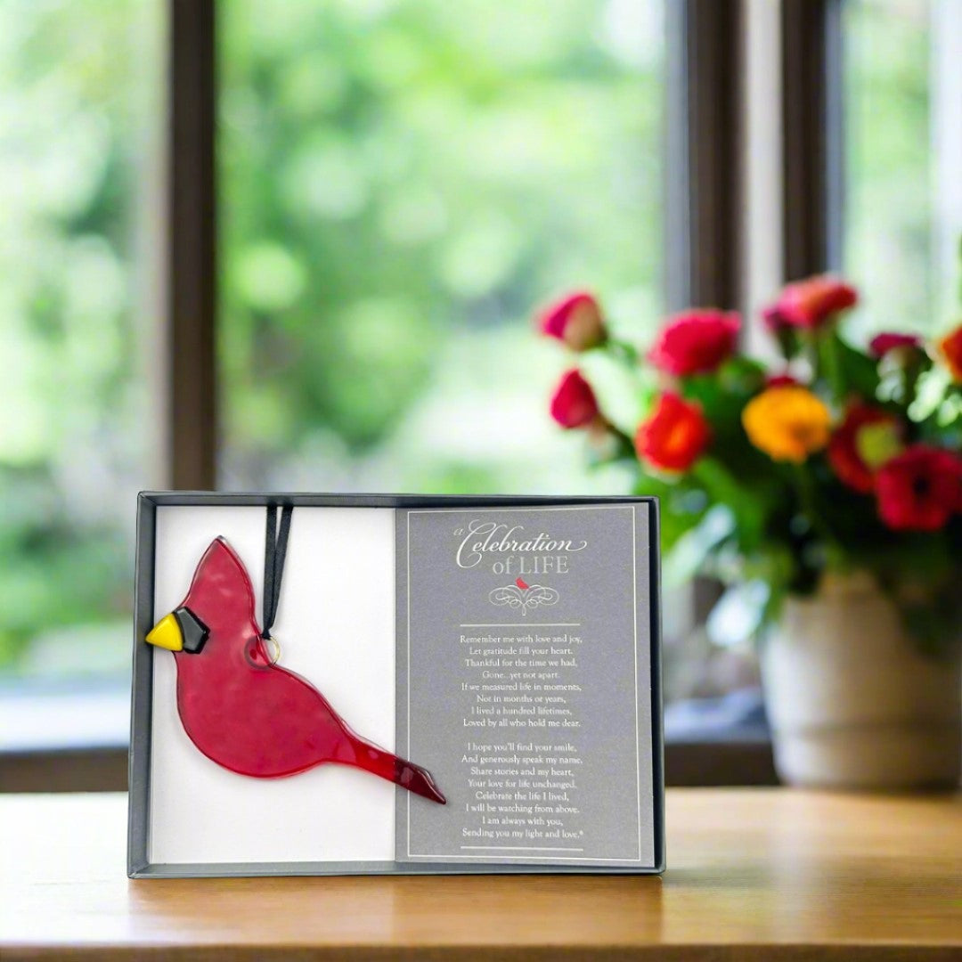 Red glass cardinal with black satin ribbon for hanging.