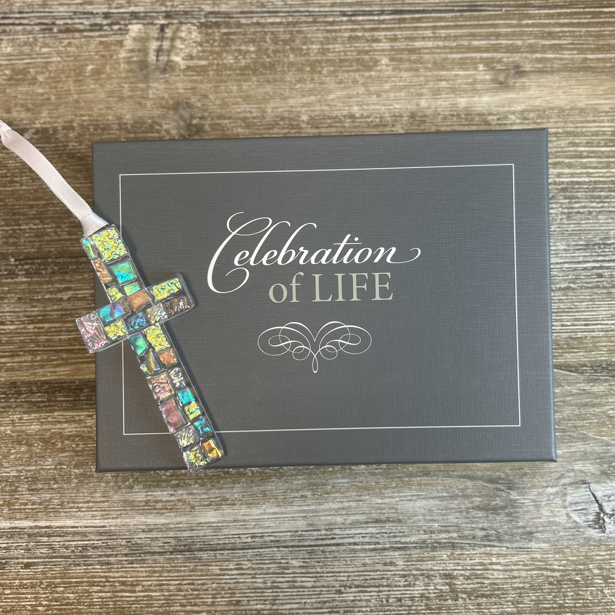 Dichroic glass cross on the Celebration of Life box.