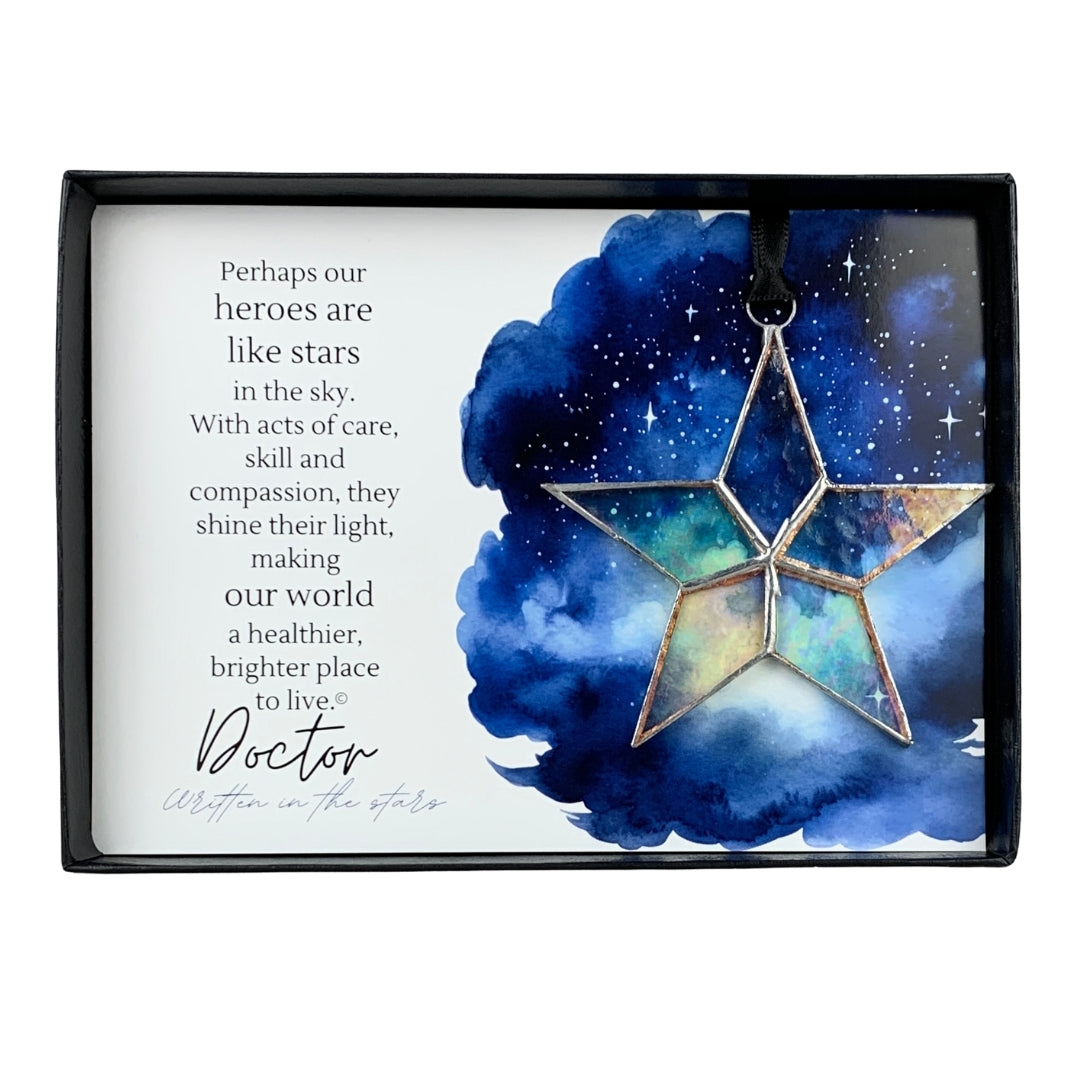 Handmade 4&quot; clear iridescent stained-glass star with silver edging, packaged with &quot;Doctor&quot; sentiment in black gift box with clear lid.