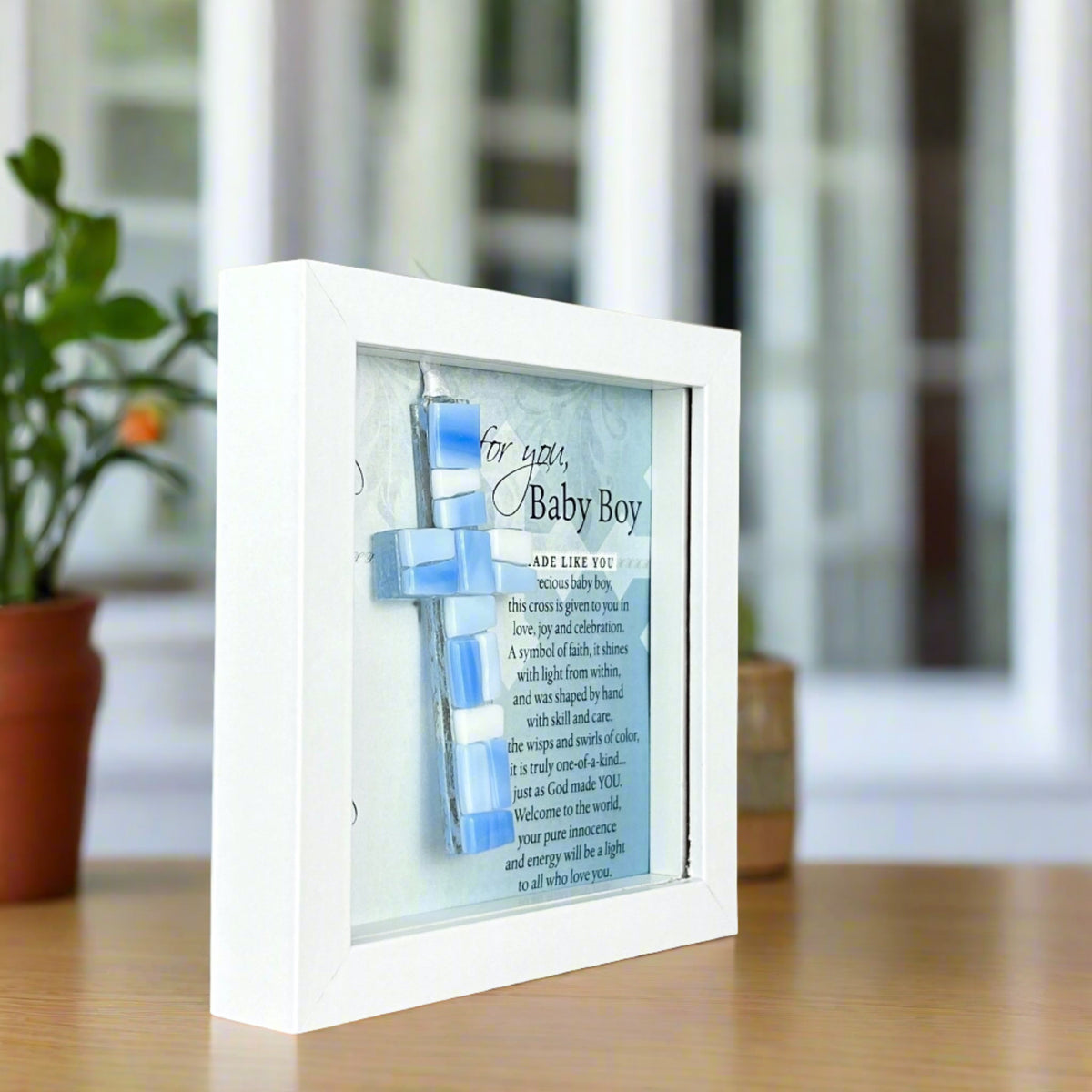 Side view of Baby Boy shadowbox frame shown standing up straight without optional easel back.