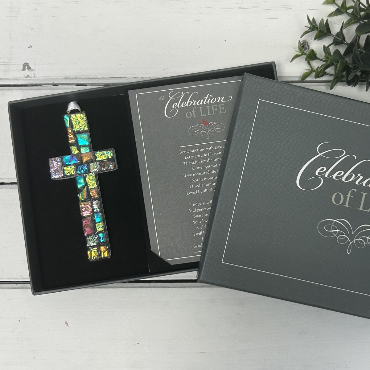 Celebration of Life cross boxed with card.