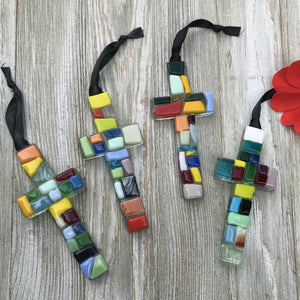 5 of 6:An assortment of colorful mosaic glass crosses.