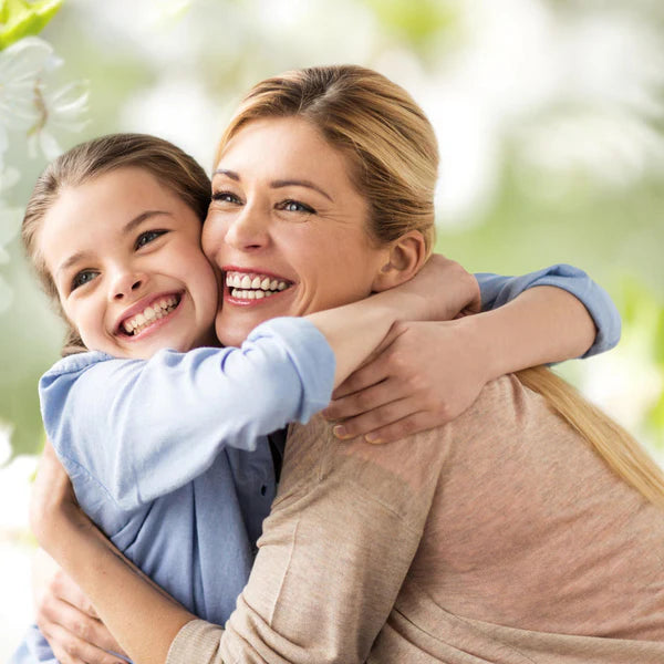 A mother and daughter hugging - Click to shop our Mother's Day Gifts