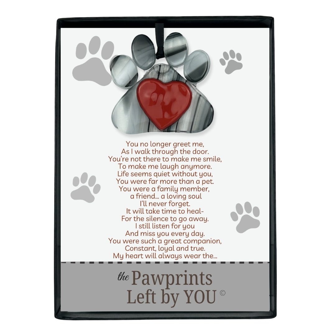 Pawprints Left By You poem and ornament packaged in a black box with clear lid.