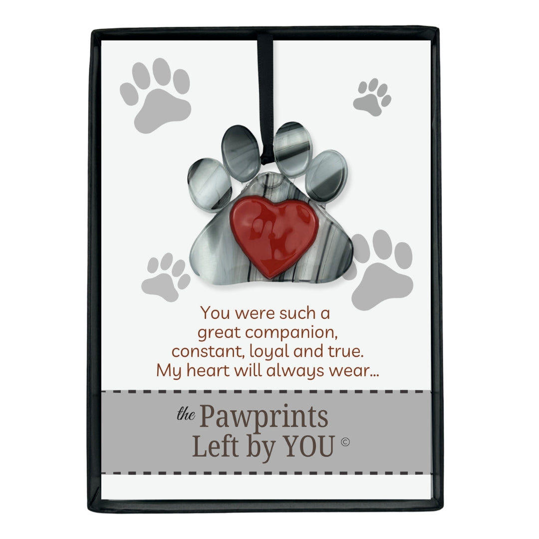 Pawprints Left By You verse and ornament packaged in a black box with clear lid.