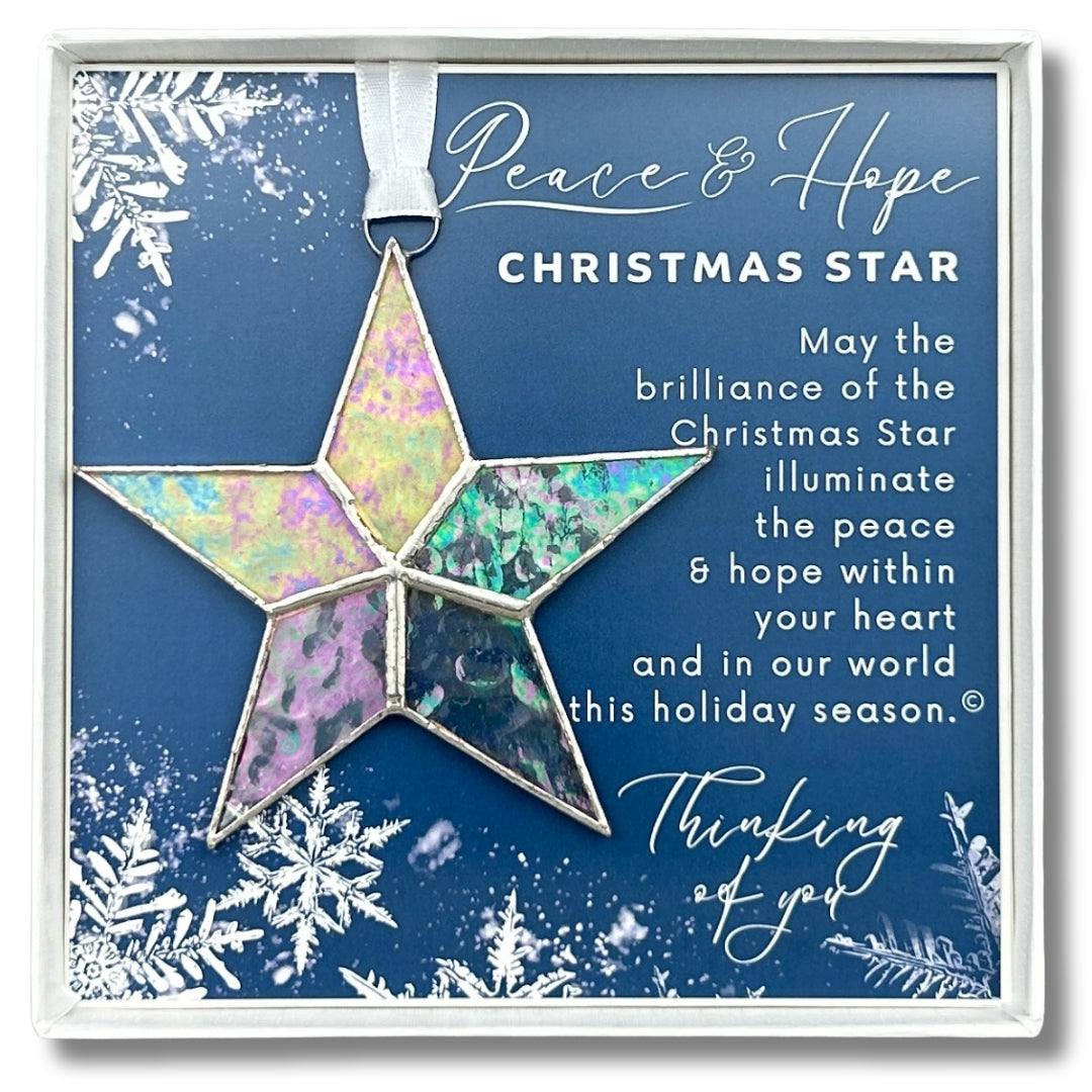 Handmade 4" clear iridescent stained-glass star with silver edging, packaged with "Peace & Hope" sentiment in white gift box with clear lid.