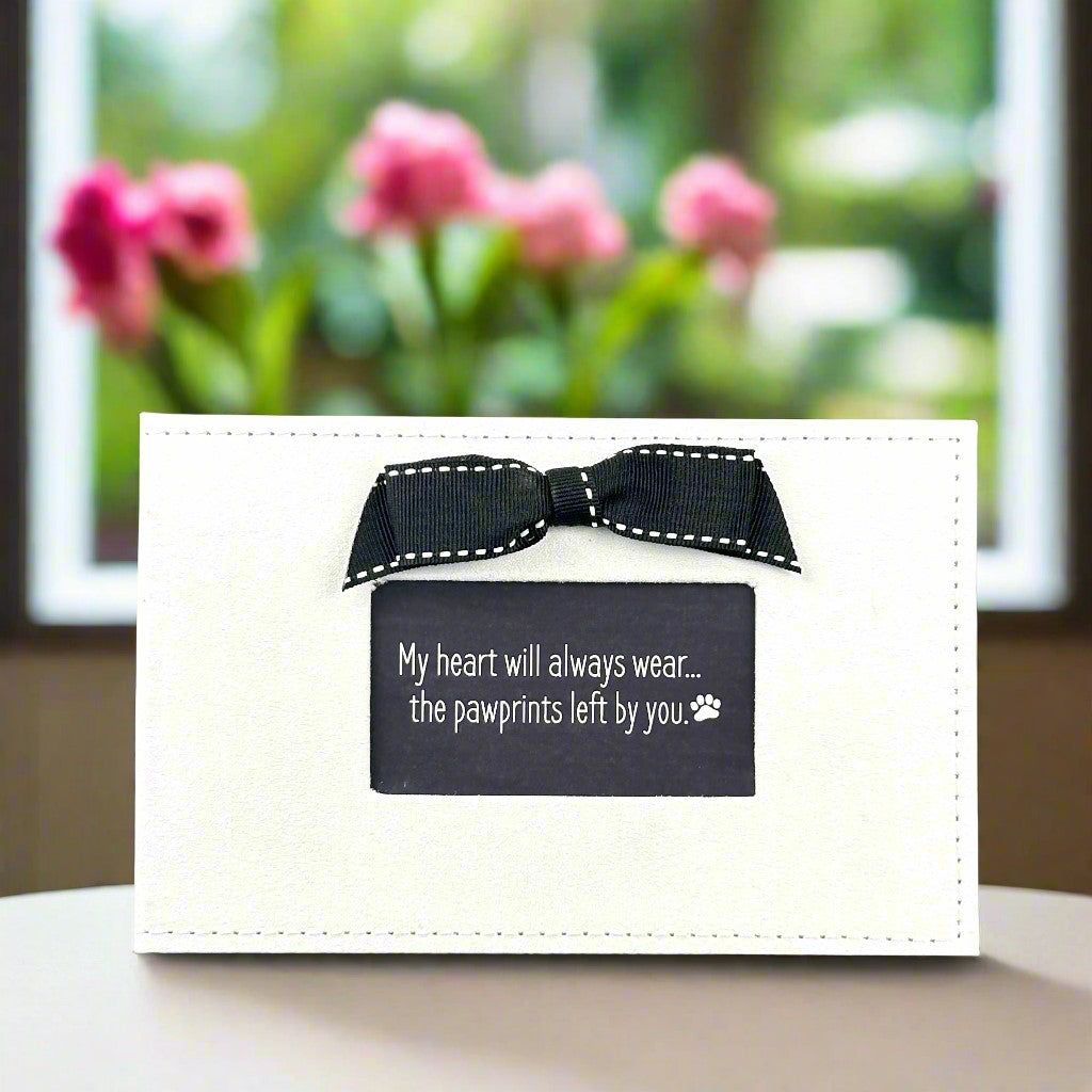 White faux suede photo album with black grosgrain ribbon bow and a window &quot;My Heart will always wear...the pawprints left by you.&quot;