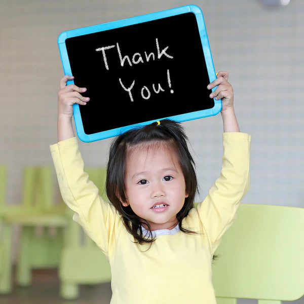 A little girl with a sign that says "Thank You" - Click to shop our Thank You and Appreciation Gifts